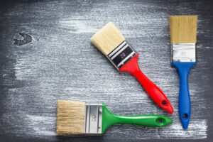 paint brush on wooden painted background