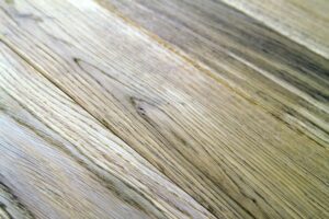 Several planks of beautiful laminate or parquet flooring with wooden texture as background